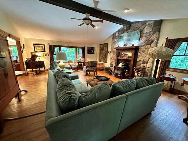 Building Photo - Dream Home in Highland, Michigan: Your Private Oasis on 5 Wooded Acres