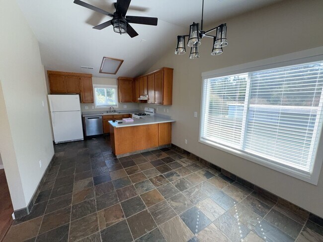 Building Photo - Newley updated 3-bedroom home features fenced yard, garage, and covered patios!