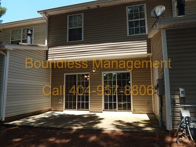 Building Photo - Larger Than It Looks! 3 BR/2.5 BA Town Hom...