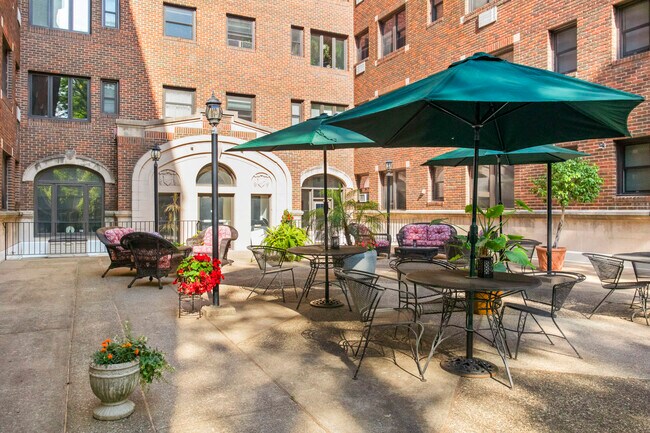 Community patio & entrance to building - 79 Western Ave N