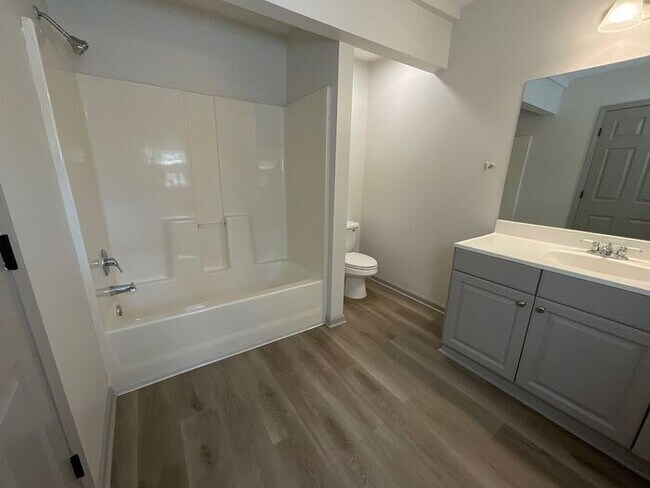 Building Photo - **Spacious 4BR with Modern Upgrades & Cove...