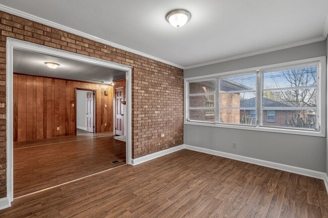 Building Photo - Large Brick Ranch, New Wood Like Flooring Throughout, Just Painted, LR, Den, Sun Room, Carport!