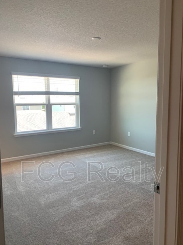 Building Photo - 6013 Blue Lily Wy