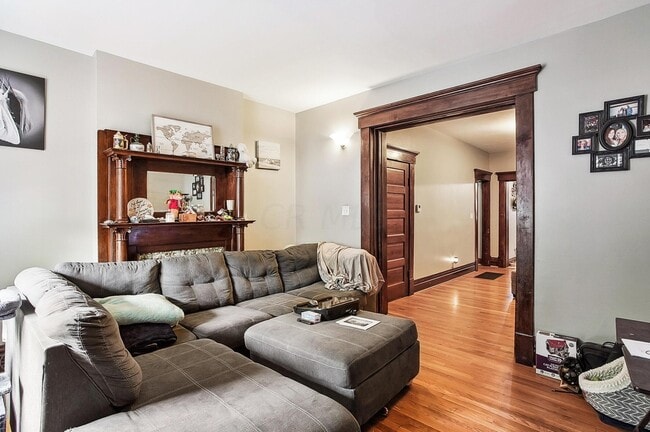 Living Room with Hardwood Floors and Decorative Fireplace - 666 S 9th St