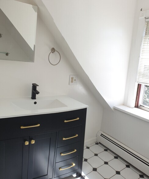 - A timeless black-and-white bathroom accented with a brand-new vanity _ clean, fresh, and stylish - 412 Morris Ave
