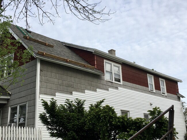 May 2021 ~ new roofing, siding, wrapped windows, and gutters! - 1225 W Madison St