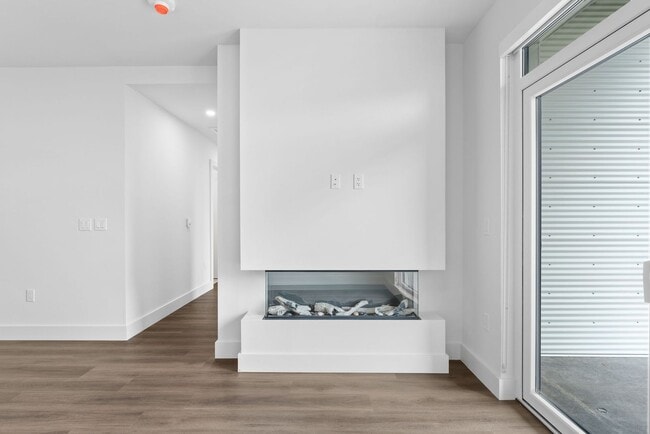 Building Photo - 2 Bedroom Corner-Unit with Wooded Balcony ...