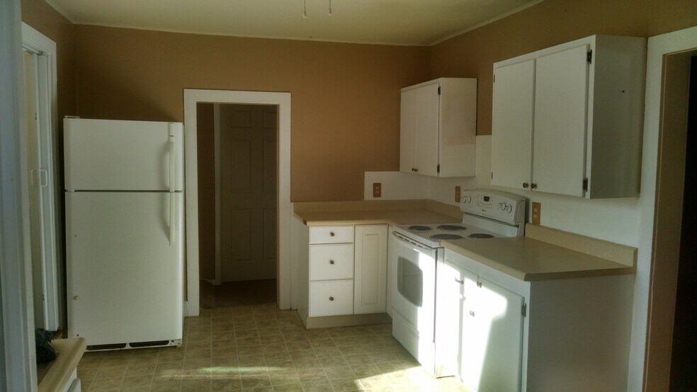 Kitchen - Refrigerator and electric stove furnished. - 111 Washington Avenue