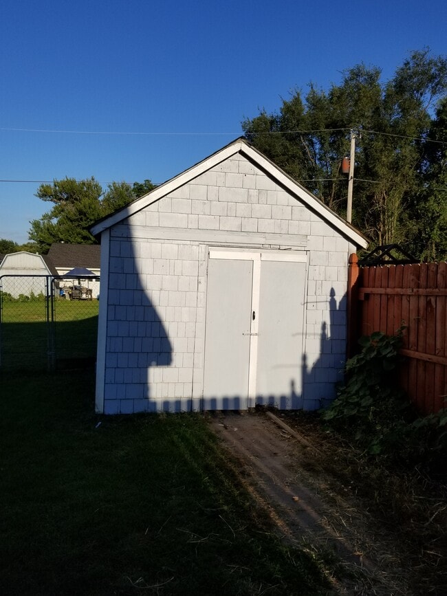 Building Photo - Gray House by Church