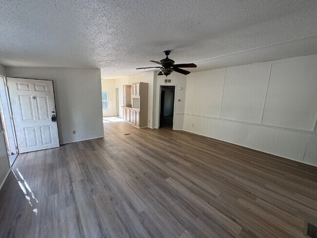 Building Photo - 3 bed 2 bath on one acre lot. New vinyl flooring throughout.