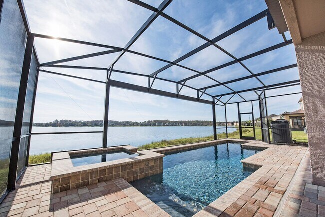 Building Photo - Large, Executive style 3/2.5 Lakefront/POOL Home in East Park of Lake Nona