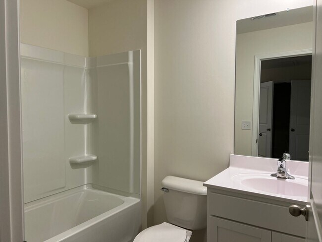 Building Photo - Beautiful New Construction 3 bedroom 2.5 Condo   with garage- Water, trash & sewer incuded!