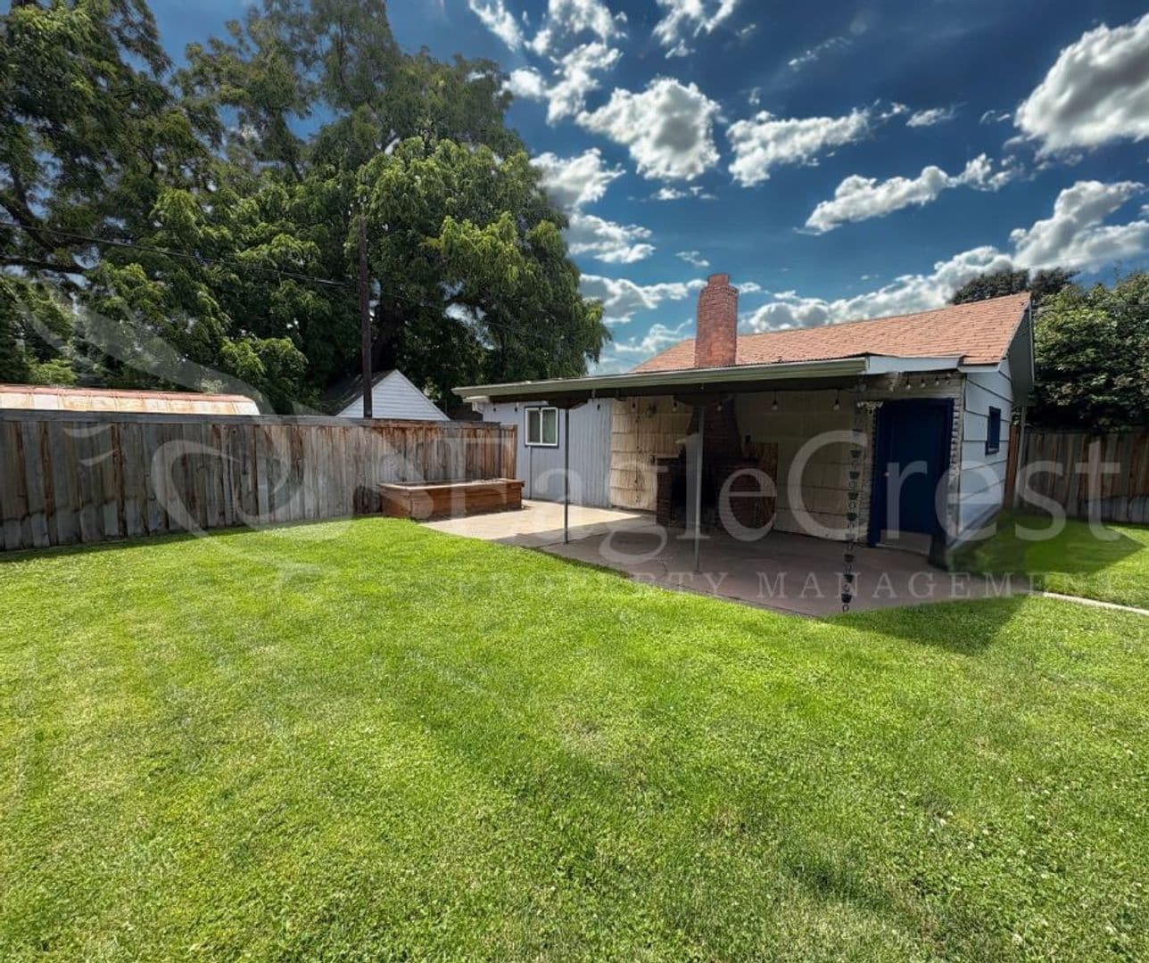 Building Photo - Three Bedroom, Two Bathroom House with Fenced Yard and Outdoor Fireplace