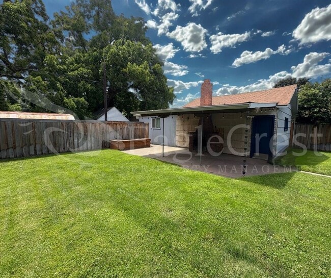 Building Photo - Three Bedroom, Two Bathroom House with Fenced Yard and Outdoor Fireplace