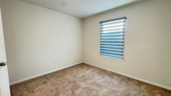 Building Photo - Available NOW! Spacious 4BD/2BA Haven in Villages at Harmony – Your Dream Home Awaits! WASHER & D...