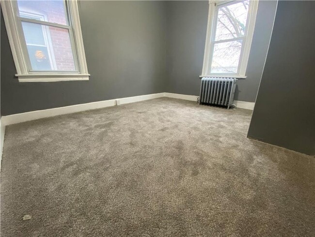 Building Photo - Charming three-bedroom row house available...