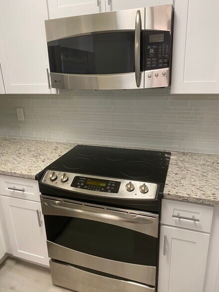 GE Profile appliances with new backsplash - 23660 Walden Center Dr