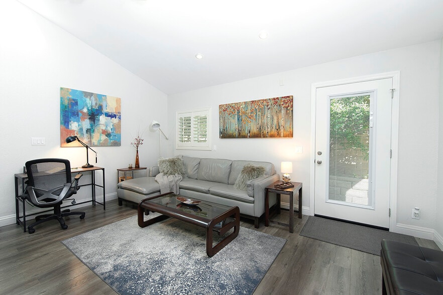 TV seating area next to a Dedicated Workstation - 73 Summerfield St