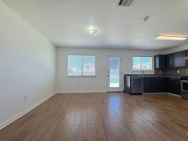 Building Photo - East El Paso 3bed/2bath Refrig A/C & Synthetic Lawn!