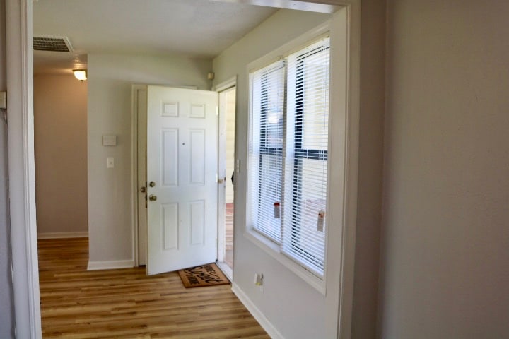 View of living room/front door from dining area/kitchen. - 1439 N Olympia Ave