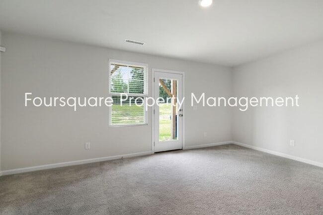 Building Photo - Stylish 3-Level Townhome with Bonus Suite, Deck & Garage – Near I-540 and Shopping