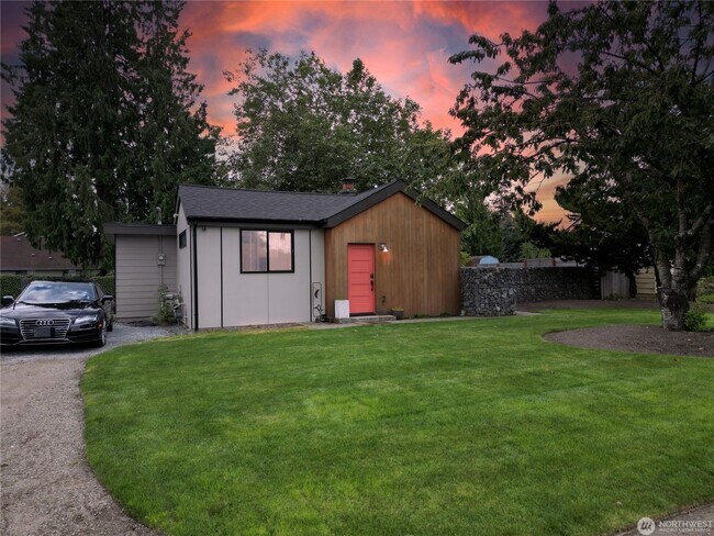Building Photo - Remodeled 3 bdrm home on a large lot with 500 sq ft wrap around deck!