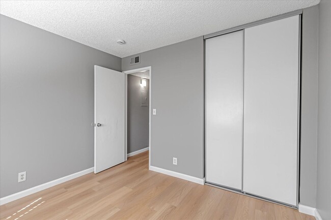 Building Photo - Stylish End-Unit Condo l Private Patio l C...