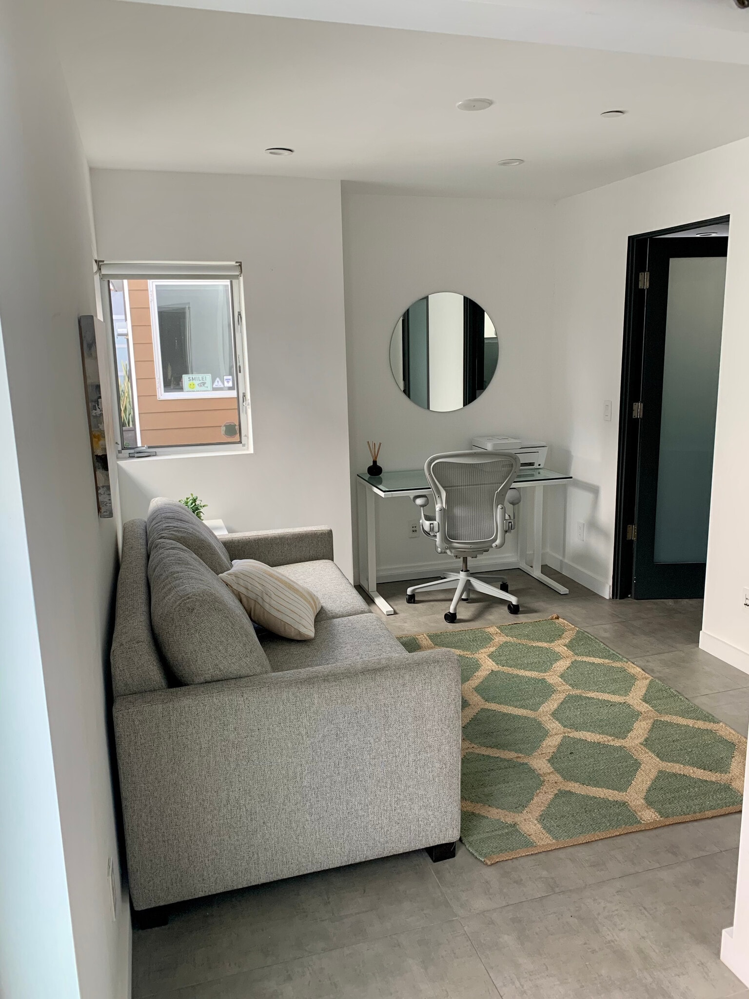 1st Floor guest room / office with a comfortable pull-out sofa. Sliding Barn door & ensuite bathroom - 7197 Formosa Fusion Ct