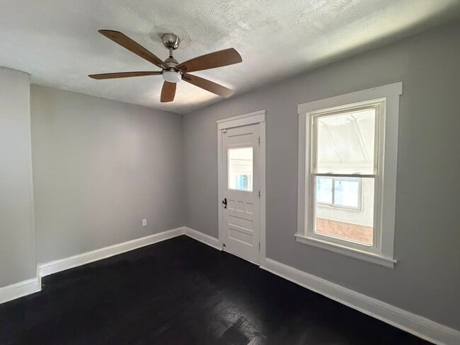 Building Photo - Four bedrooms. A sunroom. A fenced yard. A garage. Your next home is ready to be discovered!
