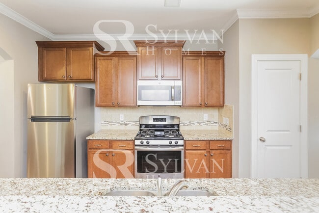 Building Photo - The living is easy in this lovely 5 bedroom, 2.5 bathroom home