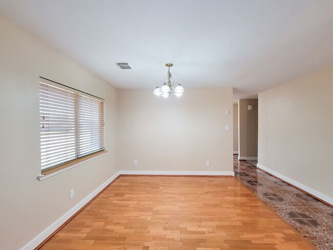 Building Photo - 3 bedroom one story home on large corner lot. Home has hard flooring throughout living areas and ...