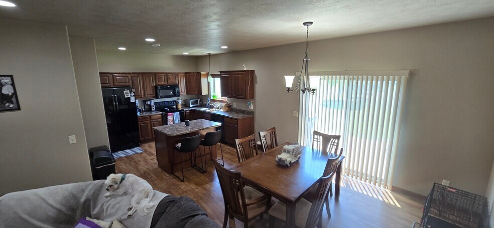 Open Kitchen and Eating Area with Access to Yard from Patio Door - 8413 W 53rd St