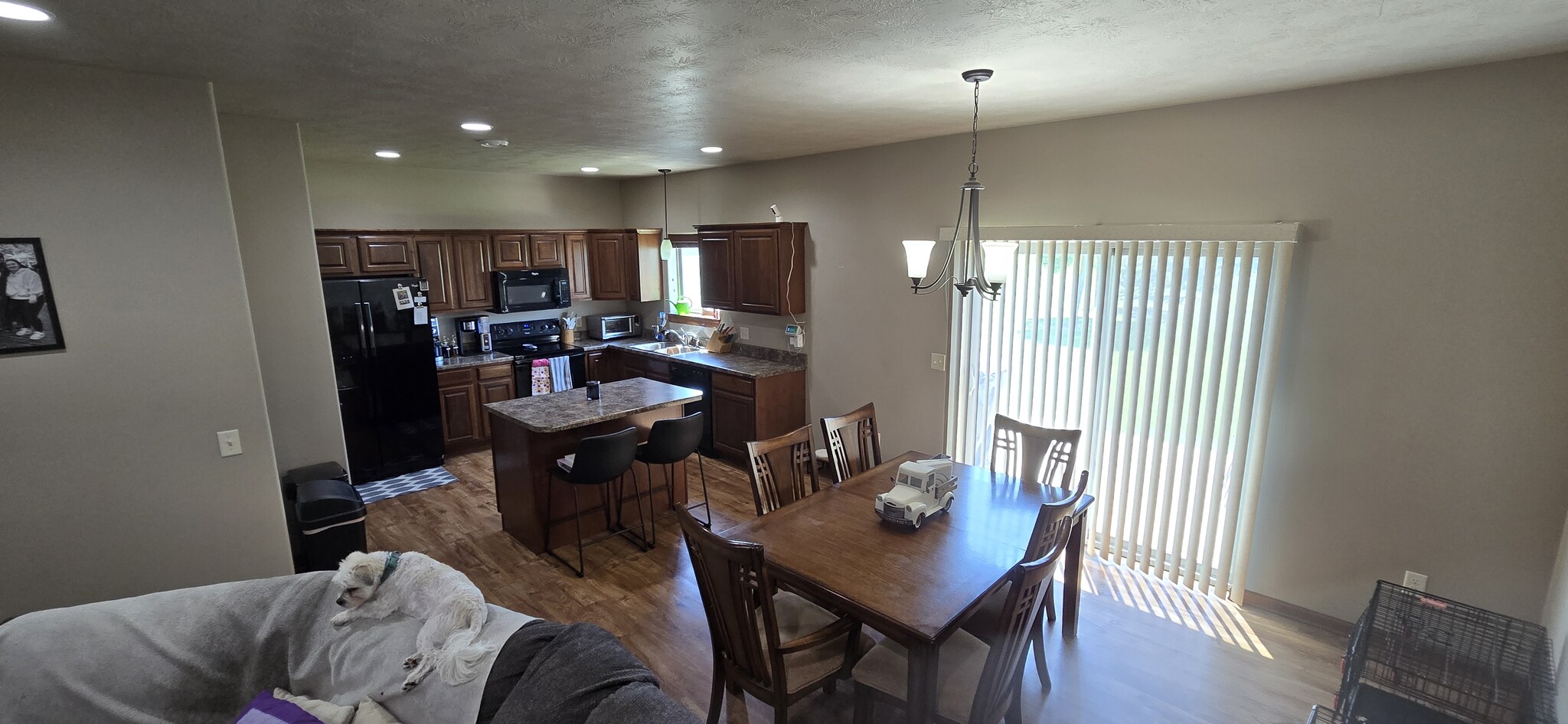 Open Kitchen and Eating Area with Access to Yard from Patio Door - 8413 W 53rd St