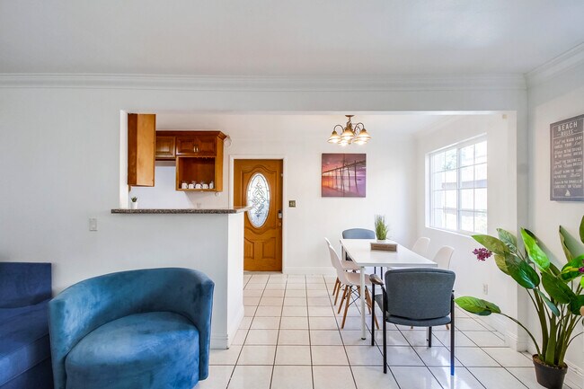 You'll love the seamless transition from the living area to the kitchen & dining space - 2304 E 14th St