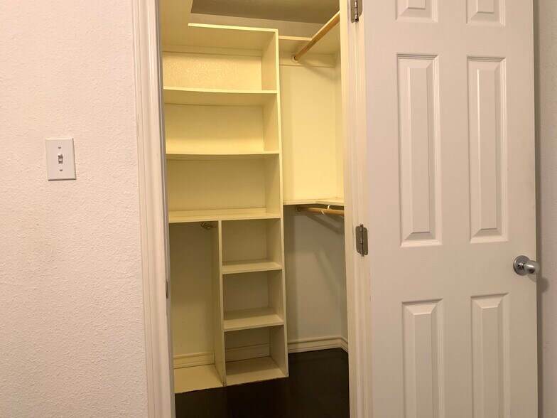 Walk in closet with storage shelves. 1x1 Condo in Hyde Park. 407 E 45th St. Austin. 78751 - 407 E 45th St #116