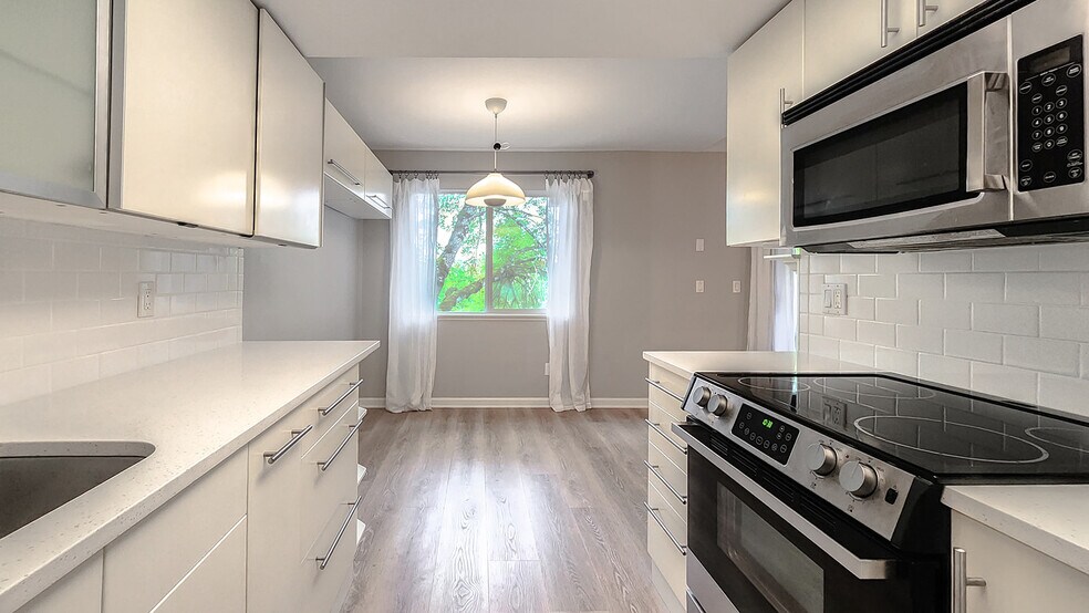 New quartz countertops and subway tile backsplash - 9580 SW 146th Ter
