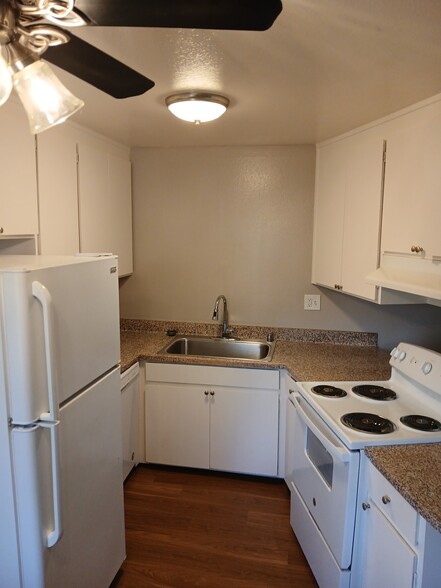 Unit #31_ all electric kitchen_ full sized appliances_ dishwasher _ range _ refrigerator_ ss sink - River Park Vista Apartments