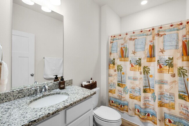 Building Photo - "Charming 4-Bed Oasis with Granite Touches in Gulf Breeze – Solar Panels !"