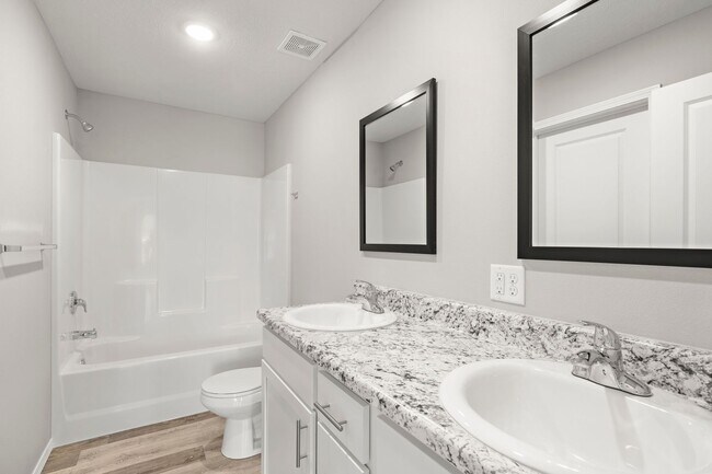 Building Photo - 4 bedroom home with a fenced in yard!