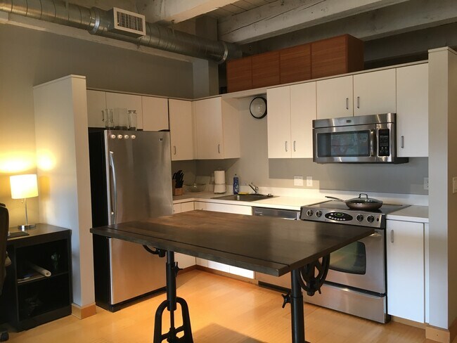 Building Photo - Historic Chown Pella Lofts - east facing studio w/parking/most utilities/rooftop deck