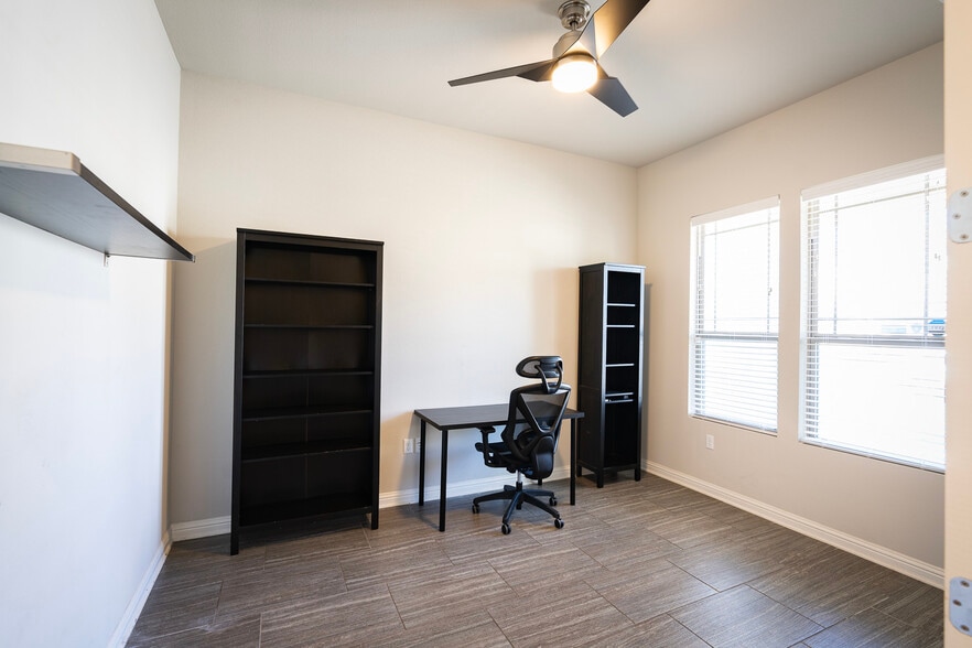 Office with desk, shelving, and mesh office chair - 1711 Arcilla St