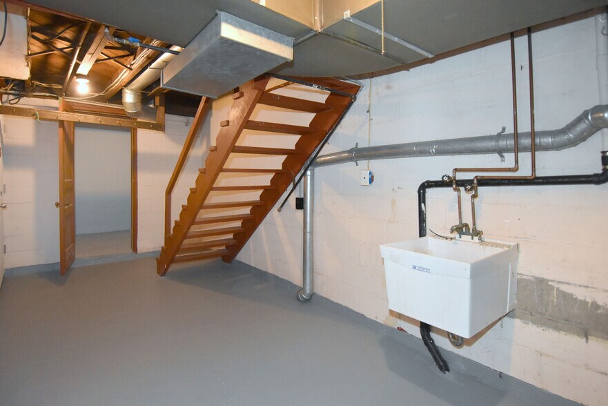 Spacious basement with newly painted floors and washer/dryer hookups - 3004 Willett Rd