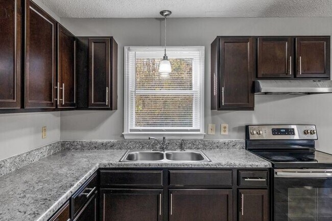 Building Photo - NE Home - Updated Kitchen and Bathrooms! SS Appliances, Fire Place, Front Porch & Deck, Fenced Yard!