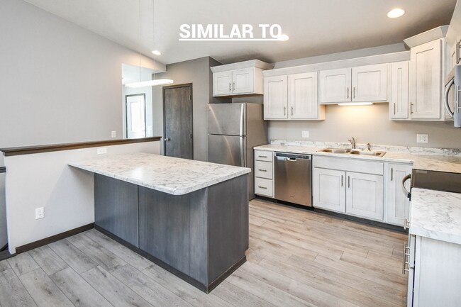 Building Photo - East Sioux Falls 4-Bedroom Townhome – Style, Space & Convenience!