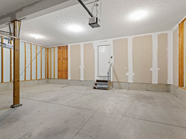 Building Photo - Renter's Dream with Triple Car Garage