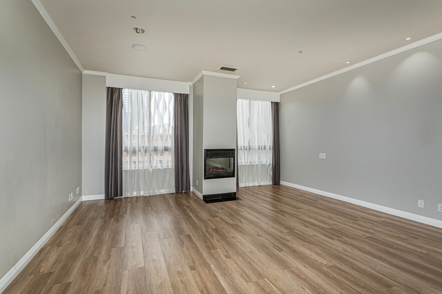 Primary Bedroom with decorative fireplace - 700 Front St
