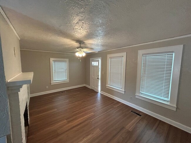 Building Photo - Freshly Painted 2x1 with Brand-New Plank Floors