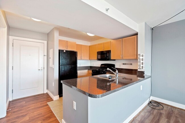 Building Photo - Available Now! Electric, Gas and Water included in Rent! Spacious Studio in an Amenity Rich Build...