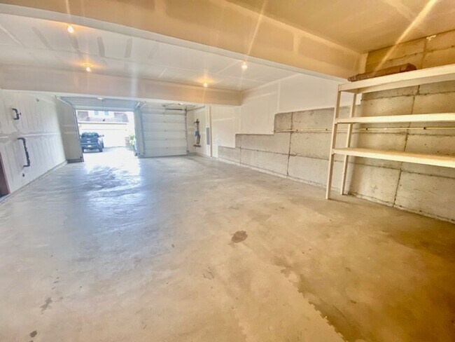 Building Photo - Beautifully Renovated 4 bedroom Home with attached 4 car garage!