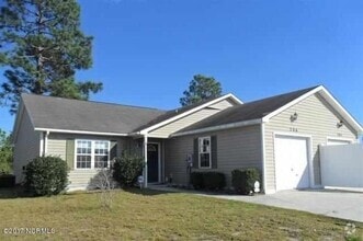 Building Photo - "Cozy Coastal Living: Charming 2-Bed, 2-Ba...